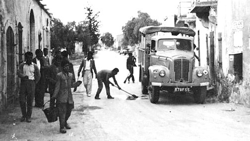 Super spy ancestry story. Villagers in Ayios Theodhoros remove EOKA slogans from the roadway